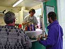 Charlotte serves the tea at Wilf's caf