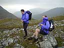 Putting on windproofs on Beallach Coire Mhalagan