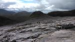 Crossing the Quartzite slabs beneath Sgurr Ban