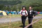 A mixed team runs down the finish funnel