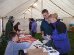 Teams register in the Event Centre marquee
