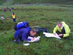 One of the lead teams plot their course at the chasing start