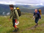 A team climbs high above Glen Carron