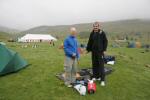 David Hard (L) and Kevin Ash (R) pick a prime site for their tent