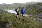 A team runs down off Mullach an Leathaid Riabhaich