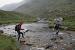 A team crosses the river flowing into Loch Beag