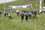 A mixed team runs over the finish line