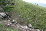 Teams cross a washed out gully