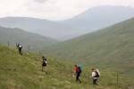 Teams tackle a long contour above the glen that leads back to the finish