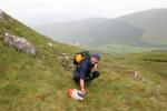 Punching at west side of knoll, the penultimate control on the A and D courses