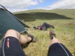 Euan Cameron (D5) stretches his legs after the first day while Andy Cochrane grabs a nap at MidCamp